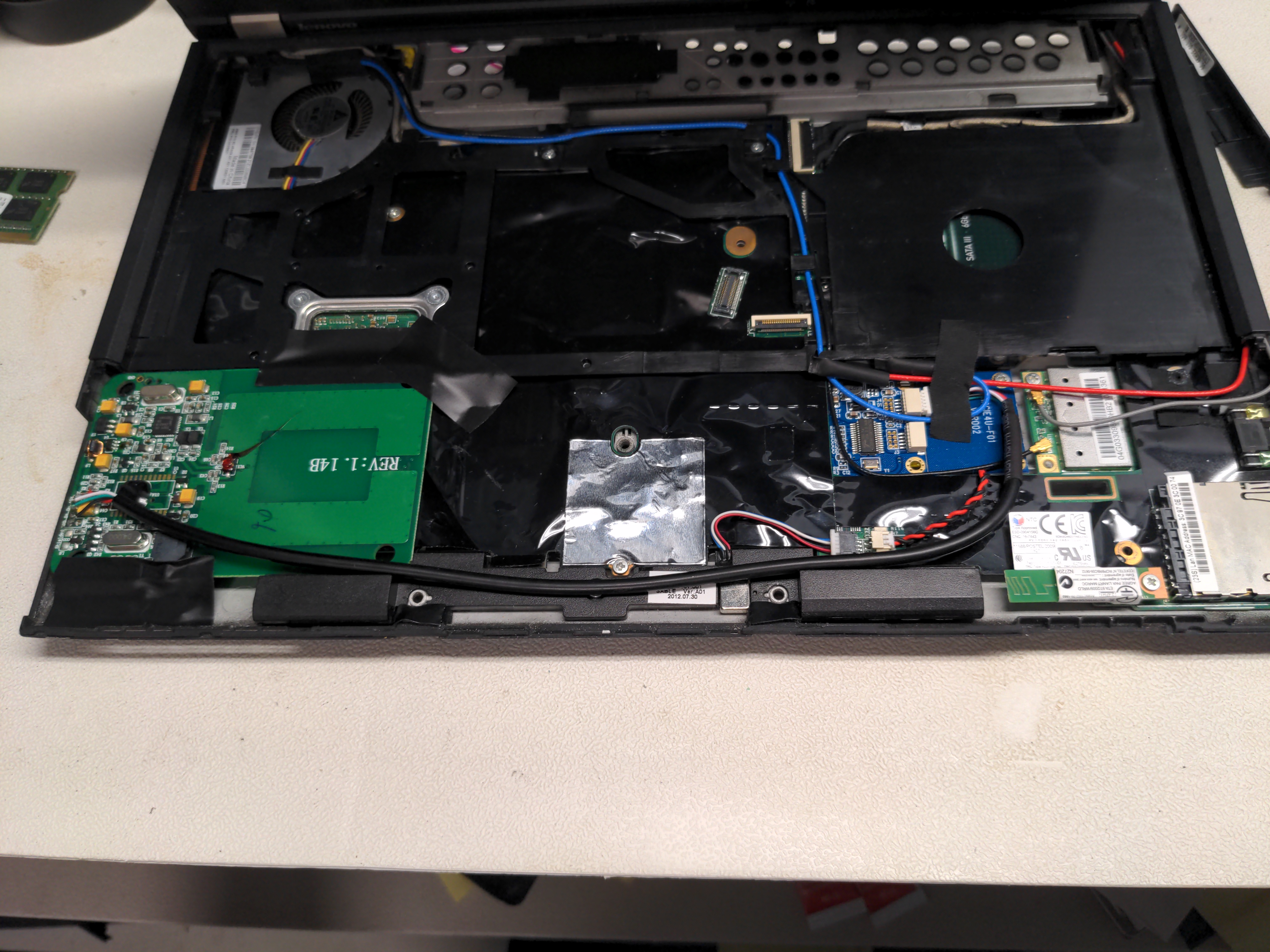 Reader set in place in unassembled laptop