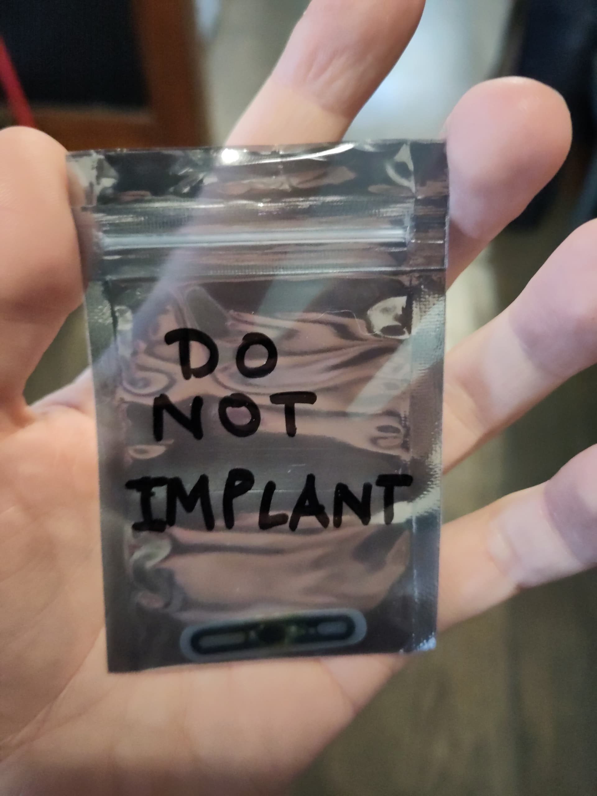 Back with damaged implant which says 'DO NOT IMPLANT'
